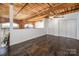 Loft area with dark tile flooring and ceiling fan at 201 S Hoskins Rd # 313, Charlotte, NC 28208