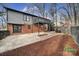 Private backyard with patio, deck, and wooded area at 204 Swamp Fox Dr, Fort Mill, SC 29715