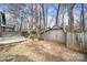 Backyard with storage shed and wooded area at 204 Swamp Fox Dr, Fort Mill, SC 29715