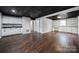 Finished basement recreation room with dark ceilings and wet bar at 204 Swamp Fox Dr, Fort Mill, SC 29715