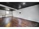 Finished basement with built-in shelving and dark ceilings at 204 Swamp Fox Dr, Fort Mill, SC 29715