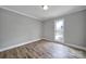 Bright bedroom with hardwood floors and window views at 204 Swamp Fox Dr, Fort Mill, SC 29715