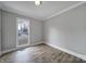 Light and airy bedroom with hardwood floors and a window at 204 Swamp Fox Dr, Fort Mill, SC 29715