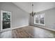 Spacious dining room with hardwood floors and large windows at 204 Swamp Fox Dr, Fort Mill, SC 29715