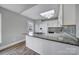 White kitchen with granite countertops and tile backsplash at 204 Swamp Fox Dr, Fort Mill, SC 29715