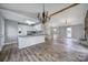 Kitchen with granite countertops, white cabinets, and breakfast bar at 204 Swamp Fox Dr, Fort Mill, SC 29715