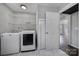 Laundry room with washer, dryer and overhead shelving at 204 Swamp Fox Dr, Fort Mill, SC 29715