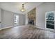 Living room with stone fireplace and hardwood floors at 204 Swamp Fox Dr, Fort Mill, SC 29715