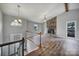 Spacious living room with stone fireplace, hardwood floors, and vaulted ceiling at 204 Swamp Fox Dr, Fort Mill, SC 29715