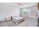 Bright bedroom featuring a ceiling fan, large windows, and carpeted flooring at 2065 Taney Way, Fort Mill, SC 29707