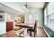 Dining area with hardwood floors, wooden table with bench, and view of the kitchen at 2065 Taney Way, Fort Mill, SC 29707