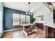 Stylish dining room with modern table, chairs, bench, and a large window for natural light at 2065 Taney Way, Fort Mill, SC 29707