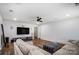 Bright living room with hardwood floors, modern ceiling fan, and comfortable seating arrangement at 2065 Taney Way, Fort Mill, SC 29707