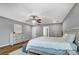 Main bedroom with hardwood floors, neutral paint, a ceiling fan, and lots of natural light at 2065 Taney Way, Fort Mill, SC 29707