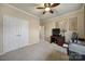 Bedroom with a large closet, desk, and ceiling fan at 23234 Kingfisher Dr, Indian Land, SC 29707