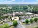 Overhead image of a community clubhouse featuring a pool, ample parking, and landscaped entrance at 23234 Kingfisher Dr, Indian Land, SC 29707