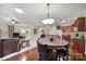 Open-concept dining area with stylish lighting and easy access to the living room and kitchen at 23234 Kingfisher Dr, Indian Land, SC 29707