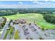 Aerial view of golf course and clubhouse with parking; residential area in background at 23234 Kingfisher Dr, Indian Land, SC 29707