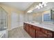 Bright and open main bathroom with dual sinks and separate tub and shower at 23234 Kingfisher Dr, Indian Land, SC 29707