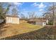 Large grassy backyard featuring a storage shed and a view of the home at 2357 13Th Street Ne Dr, Hickory, NC 28601