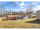 Backyard view featuring a well-maintained lawn, fence, and exterior of the home at 2357 13Th Street Ne Dr, Hickory, NC 28601