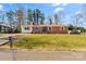 Charming brick ranch home with a well-maintained front lawn and mature trees at 2357 13Th Street Ne Dr, Hickory, NC 28601