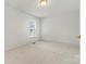 Bright bedroom with carpet, window, and ample closet space at 2363 24Th Street Ne Ln, Hickory, NC 28601