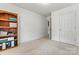 Bedroom with wood shelving and an adjacent closet at 2363 24Th Street Ne Ln, Hickory, NC 28601