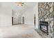 Living room featuring a stone fireplace and ample natural light at 2363 24Th Street Ne Ln, Hickory, NC 28601