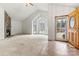 Living room with vaulted ceiling, stone fireplace, and large windows at 2363 24Th Street Ne Ln, Hickory, NC 28601