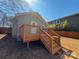 Exterior view of a home featuring a backyard deck, privacy fence, and landscaping, offering a relaxing outdoor space at 238 Coxe Ave, Charlotte, NC 28208