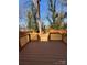 View of backyard with wooden deck, lawn, wooden fence, and mature trees, perfect for outdoor enjoyment and relaxation at 238 Coxe Ave, Charlotte, NC 28208