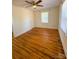 Cozy room boasting hardwood flooring, a ceiling fan, and lots of natural light at 238 Coxe Ave, Charlotte, NC 28208