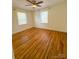 Charming room showcasing hardwood flooring and natural light from two windows at 238 Coxe Ave, Charlotte, NC 28208