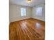 Light-filled room featuring hardwood flooring and natural light from dual windows at 238 Coxe Ave, Charlotte, NC 28208