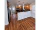 Cozy kitchen featuring wooden cabinets, stainless steel appliances, and an open layout at 238 Coxe Ave, Charlotte, NC 28208