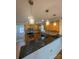 Well-lit kitchen with wood cabinets, granite countertops, and pendant lighting at 238 Coxe Ave, Charlotte, NC 28208