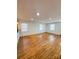 Sunny living room featuring wood floors, recessed lighting, and windows at 238 Coxe Ave, Charlotte, NC 28208