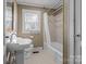 Bathroom with tub, shower, sink, and toilet at 2614 S Us 321 Hwy, Newton, NC 28658