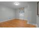 Simple bedroom with hardwood floors and large window at 2614 S Us 321 Hwy, Newton, NC 28658