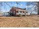 Brick ranch house with a front porch, situated on a spacious lot with mature trees at 2614 S Us 321 Hwy, Newton, NC 28658