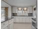 Bright kitchen with white cabinets, granite countertops, and stainless steel appliances at 2614 S Us 321 Hwy, Newton, NC 28658