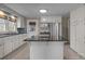 Kitchen with island, stainless steel appliances, and white cabinets at 2614 S Us 321 Hwy, Newton, NC 28658