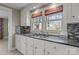 Clean kitchen, featuring granite countertops and a double sink at 2614 S Us 321 Hwy, Newton, NC 28658