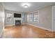 Bright living room with hardwood floors, fireplace and large windows at 2614 S Us 321 Hwy, Newton, NC 28658