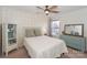 Comfortable bedroom with stylish wallpaper, ceiling fan and natural light from the window at 265 Sutro Forest Nw Dr, Concord, NC 28027