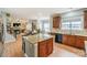 Open kitchen featuring a granite island, stainless steel appliances and clear view to the living room at 265 Sutro Forest Nw Dr, Concord, NC 28027