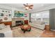 Inviting living room features a cozy fireplace, built-in shelves and a comfortable seating area at 265 Sutro Forest Nw Dr, Concord, NC 28027