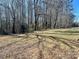 Backyard with tall trees and grassy area at 2704 Kool Park Ne Rd, Hickory, NC 28601