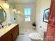 Modern bathroom with walk-in shower, marble vanity, and hexagon tile floor at 2704 Kool Park Ne Rd, Hickory, NC 28601